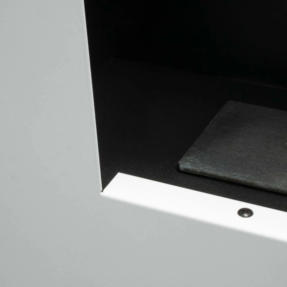 Murus 1200 glossy white bio fireplace, close-up of the frame corner and burner tray, unlit
