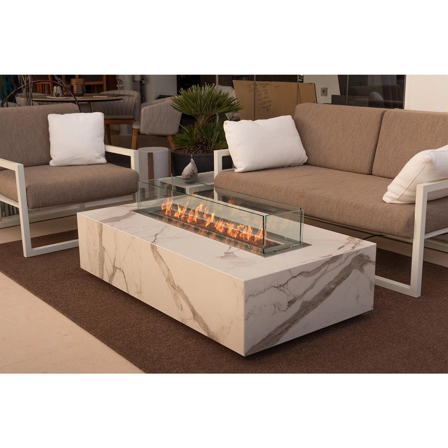 Planika Cabo bioethanol firaplace table with a frame of Cosentino dekton marble plates in Daze or Laurent finish