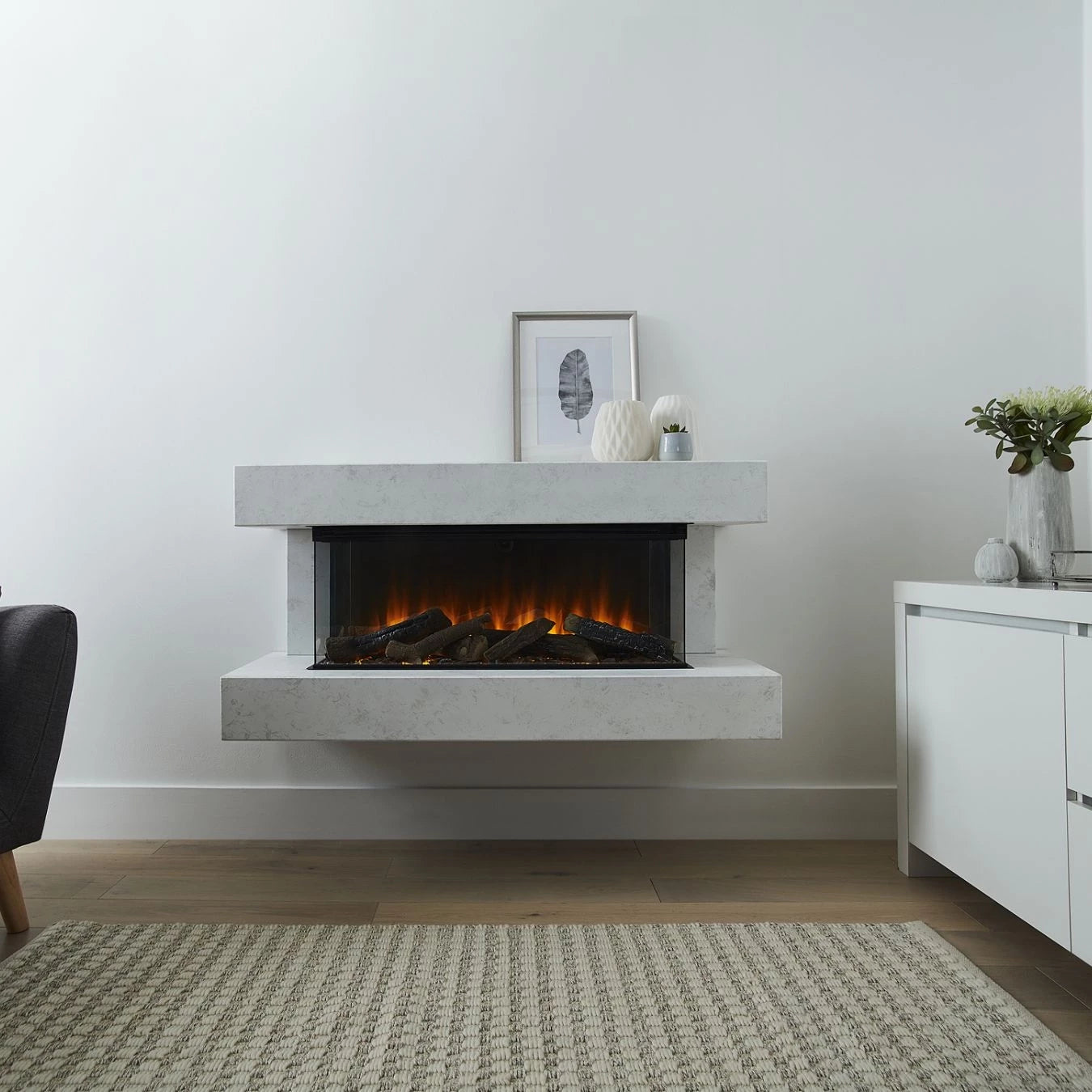 Winchester 1200 White Marble wall-mounted electric fireplace suite with mantel and three-sided flame view
